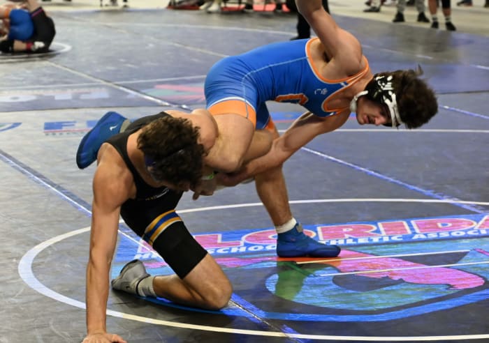 Gunner Holland from Osceola advances to the finals with this semifinal win against Tyler Secoy of Columbus during a 175-pound match on Saturday at the Knockout Christmas Classic at Silver Spurs Arena in Kissimmee.